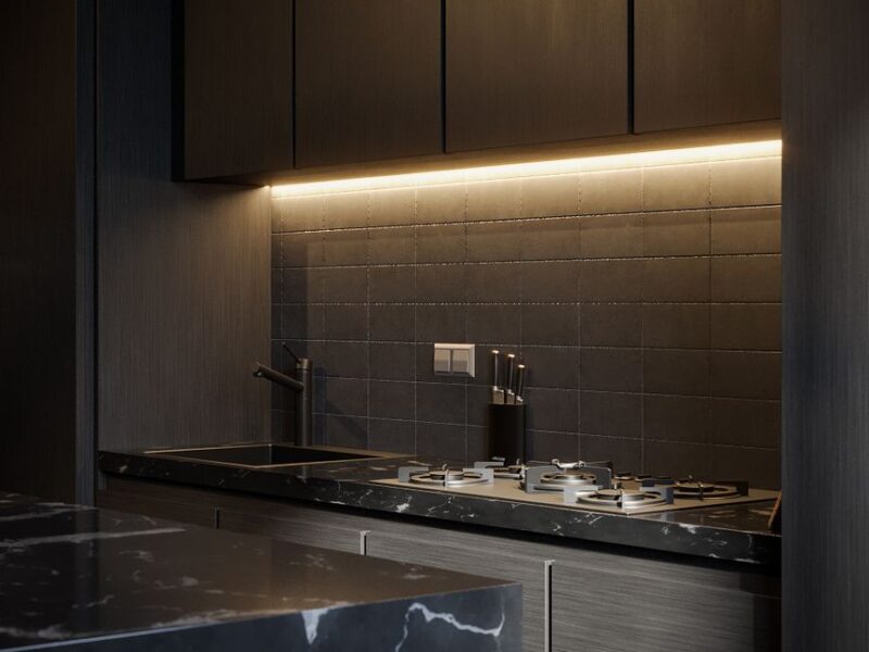 Sleek dark modern kitchen with custom cabinetry and ambient LED lighting
