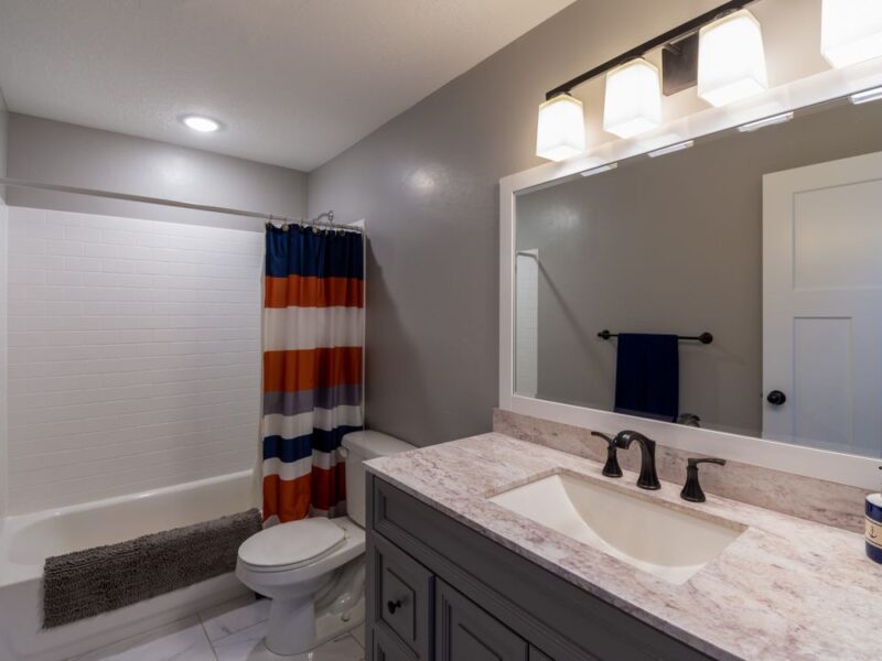 Full bathroom interior renovation with custom vanity