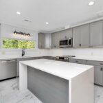 Minimalist modern flat panel kitchen cabinets in white